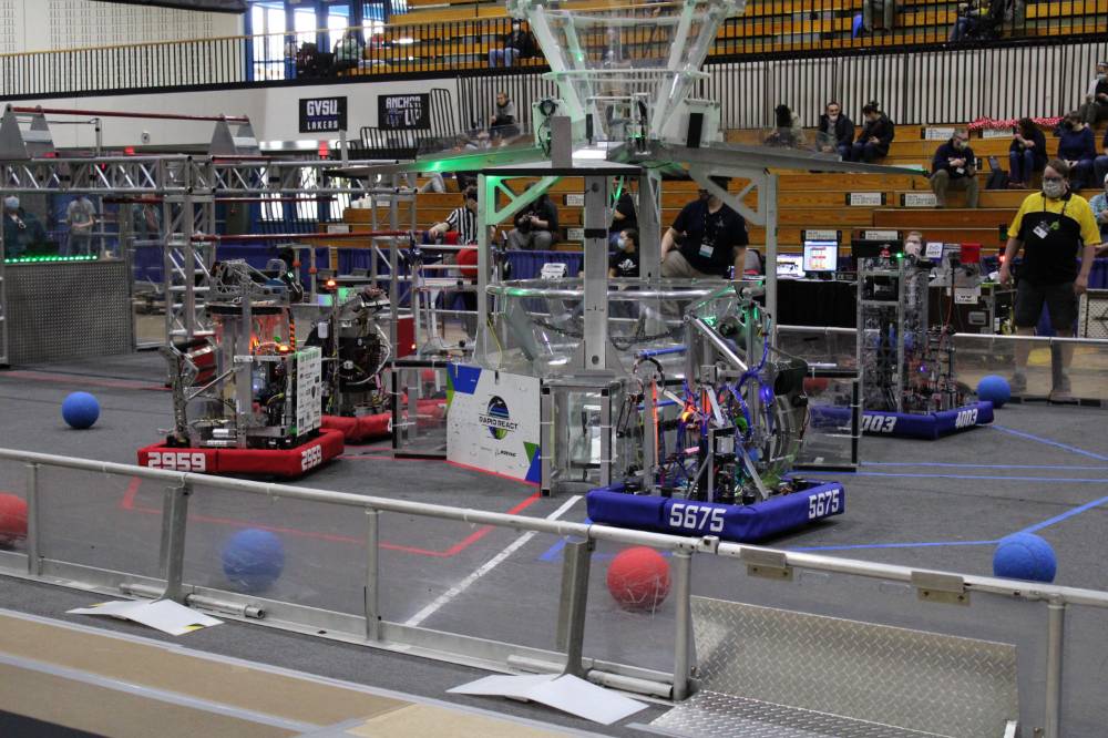 Robots wait on the field for a match to begin